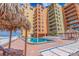 Community pool area with plenty of lounge chairs at 18610 Gulf Blvd # 402, Indian Shores, FL 33785