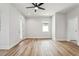 Bright bedroom with wood floors, door, and window at 2138 -1 W Beach St, Tampa, FL 33607