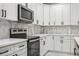 Modern kitchen with white cabinets, quartz countertops and stainless steel appliances at 2138 -1 W Beach St, Tampa, FL 33607
