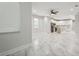 Open living room with marble flooring and view into modern kitchen at 2138 -1 W Beach St, Tampa, FL 33607