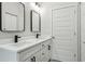 Double vanity bathroom with black matte fixtures and modern mirrors at 2138 -1 W Beach St, Tampa, FL 33607