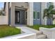 Modern entryway with gray door and white steps at 2138 -1 W Beach St, Tampa, FL 33607