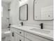 Modern bathroom with double vanity, quartz countertops, and black matte fixtures at 2138 -1 W Beach St, Tampa, FL 33607