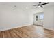 Bright bedroom featuring light wood flooring and two windows at 2138 -1 W Beach St, Tampa, FL 33607