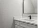 Simple bathroom with a single vanity and a modern mirror at 2138 -1 W Beach St, Tampa, FL 33607