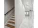 Modern staircase with wooden steps and black metal railing at 2138 -1 W Beach St, Tampa, FL 33607