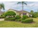 Yellow house with nicely landscaped yard at 1908 Sterling Glen Ct, Sun City Center, FL 33573