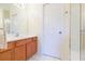 Bathroom features a vanity, shower, and linen closet at 1908 Sterling Glen Ct, Sun City Center, FL 33573