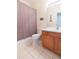 Bathroom with tub, shower, and wood vanity at 1908 Sterling Glen Ct, Sun City Center, FL 33573