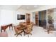 Bright sunroom with a dining area and sliding glass doors at 1908 Sterling Glen Ct, Sun City Center, FL 33573