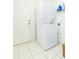 Laundry room with stacked washer and dryer at 1908 Sterling Glen Ct, Sun City Center, FL 33573