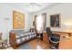 Bedroom with wood flooring, desk, and day bed at 1908 Sterling Glen Ct, Sun City Center, FL 33573