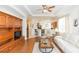 Open living room with hardwood floors, a large entertainment center, and comfortable seating at 1908 Sterling Glen Ct, Sun City Center, FL 33573