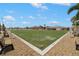 Expansive bocce ball court with benches at 1908 Sterling Glen Ct, Sun City Center, FL 33573