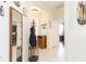 Spacious entryway with mirror and coat rack, offering ample storage at 1908 Sterling Glen Ct, Sun City Center, FL 33573