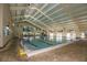 Indoor swimming pool with ample space and seating at 1908 Sterling Glen Ct, Sun City Center, FL 33573