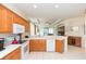 Kitchen boasts ample cabinetry, modern appliances, and a breakfast bar at 1908 Sterling Glen Ct, Sun City Center, FL 33573