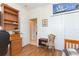 Bedroom with wood floors, built-in shelving, and closet at 1908 Sterling Glen Ct, Sun City Center, FL 33573