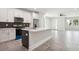 Open concept kitchen with island, stainless steel appliances, and modern finishes at 2138 - 2 W Beach St, Tampa, FL 33607