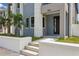Modern home entrance with gray siding and a white wall at 2138 - 2 W Beach St, Tampa, FL 33607