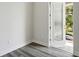 Bedroom with door to private balcony and gray vinyl flooring at 2138 - 2 W Beach St, Tampa, FL 33607