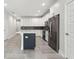 Modern kitchen with white cabinets, a large island, and stainless steel appliances at 2138 - 2 W Beach St, Tampa, FL 33607