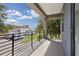 Private balcony overlooks a tree-lined street and parking area at 2138 - 2 W Beach St, Tampa, FL 33607