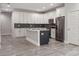 Modern kitchen with white cabinets, stainless steel appliances, and a large island at 2138 - 2 W Beach St, Tampa, FL 33607