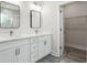 Modern bathroom with double vanity, quartz countertops, and large mirrors at 2138 - 2 W Beach St, Tampa, FL 33607
