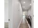 Long hallway with gray vinyl flooring, leading to other rooms at 2138 - 2 W Beach St, Tampa, FL 33607