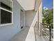 Covered balcony with tile flooring and metal railing at 2138 - 2 W Beach St, Tampa, FL 33607