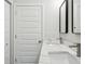 Double vanity bathroom with white cabinets and quartz countertop at 2138 - 2 W Beach St, Tampa, FL 33607