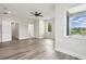 Spacious bedroom with hardwood floors, an ensuite bathroom, and large windows at 2138 - 2 W Beach St, Tampa, FL 33607