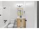 Updated bathroom with white subway tile, wood vanity, and black fixtures at 4001 58Th N St # 28, St Petersburg, FL 33709