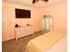 Cozy bedroom with ceiling fan, TV, dresser, armoire, and carpet flooring at 7519 Harbor View Way, Seminole, FL 33776