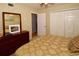 Comfortable bedroom with double bed, dresser, and large closet at 7519 Harbor View Way, Seminole, FL 33776