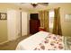 Cozy bedroom with double doors and carpet flooring at 7519 Harbor View Way, Seminole, FL 33776
