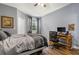 Bedroom with a queen-size bed, desk, and window at 17104 Carrington Park Dr # 520, Tampa, FL 33647