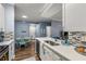 Modern kitchen with white cabinets, quartz countertops, and breakfast nook at 17104 Carrington Park Dr # 520, Tampa, FL 33647