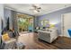 Living room with sliding glass doors to balcony and hardwood floor at 17104 Carrington Park Dr # 520, Tampa, FL 33647