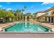 Inviting community pool with surrounding lounge chairs at 17104 Carrington Park Dr # 520, Tampa, FL 33647