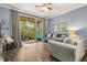 Living room with sliding glass doors to balcony and hardwood floor at 17104 Carrington Park Dr # 520, Tampa, FL 33647