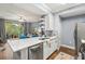 Modern kitchen with white cabinets, quartz countertops and stainless steel appliances at 17104 Carrington Park Dr # 520, Tampa, FL 33647