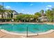Relaxing community pool with shaded seating area at 17104 Carrington Park Dr # 520, Tampa, FL 33647