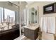 Bathroom with vanity, toilet, and city view at 175 1St S St # 1508, St Petersburg, FL 33701