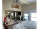 King-size bed, sitting area, and water views at 315 Medallion Blvd # H, Madeira Beach, FL 33708