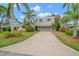 Contemporary two-story house with gray siding and attached garage at 1118 2Nd S Ave, Tierra Verde, FL 33715