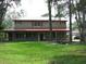 Two story home with large yard and red roof at 8945 Overlook Dr, Wesley Chapel, FL 33545