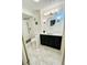 Stylish bathroom boasts a walk-in shower and sleek vessel sink vanity, enhanced by minimalist design and ample space at 51 Island Way # 1107, Clearwater Beach, FL 33767