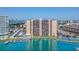 Waterfront condo building featuring boat docks, tennis court, and pool access at 51 Island Way # 1107, Clearwater Beach, FL 33767